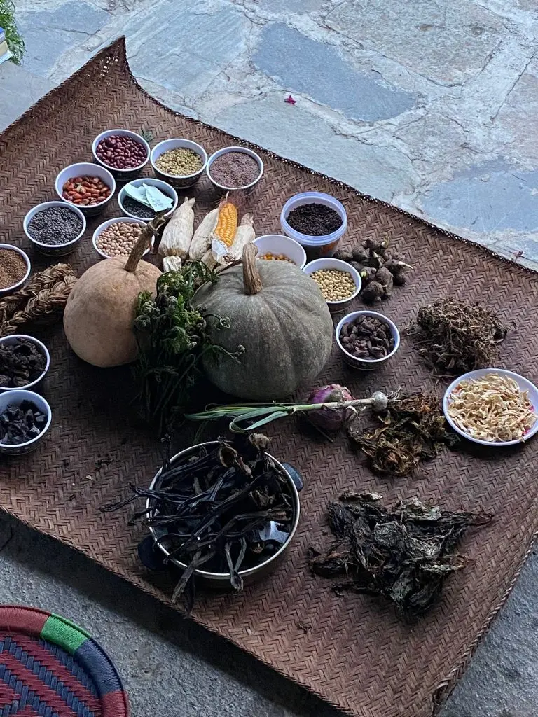 Pumpkins, dried herbs and seed cups laid out for the day’s service